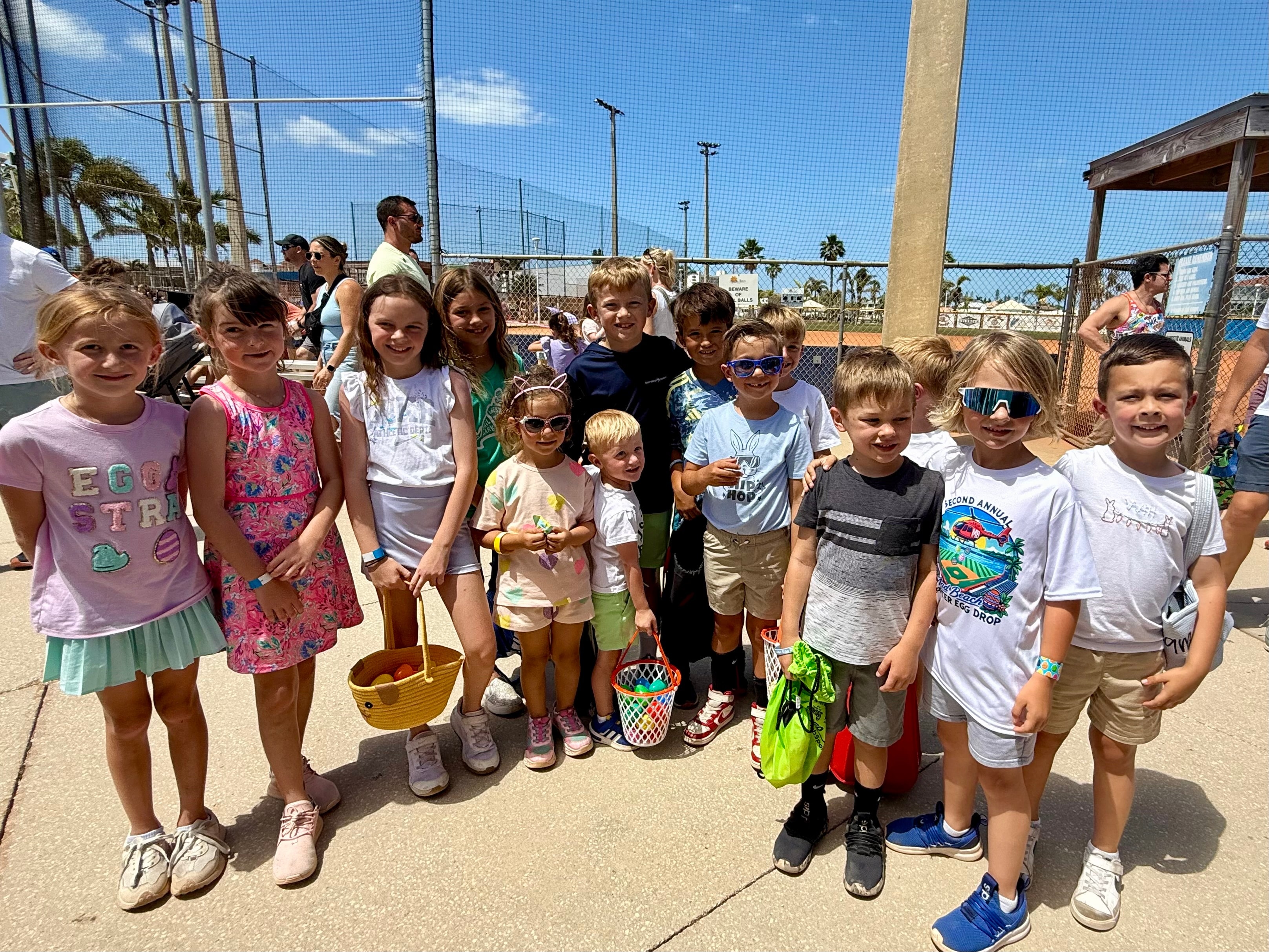Group of children at a baseball field event
